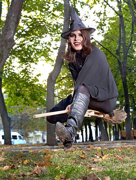 istock Witch fly on broomstick outdoor. 119413823
