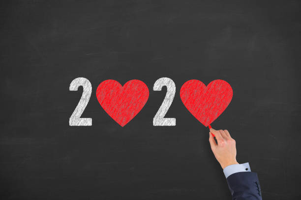 istock New Year 2020 with Heart Shape on Chalkboard Background 1194139188