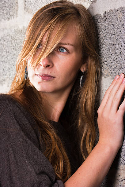 Woman and wall stock photo