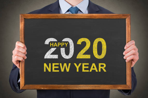 istock Happy New Year 2020 on Blackboard Background 1194143898
