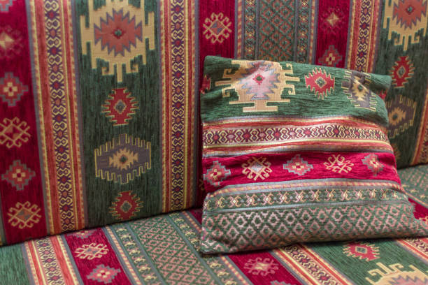 Traditional geometric pattern in turkish textile East ornament. Turkish pillows. Traditional Asian decor. Fabric for sofa and pillows. Geometric pattern. Interior decoration. Colorful coloring material. tea party horizontal nobody indoors stock pictures, royalty-free photos & images