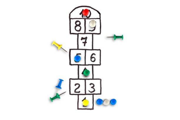 istock hopscotch game, figures depicting players in the rivalry process 1194145294