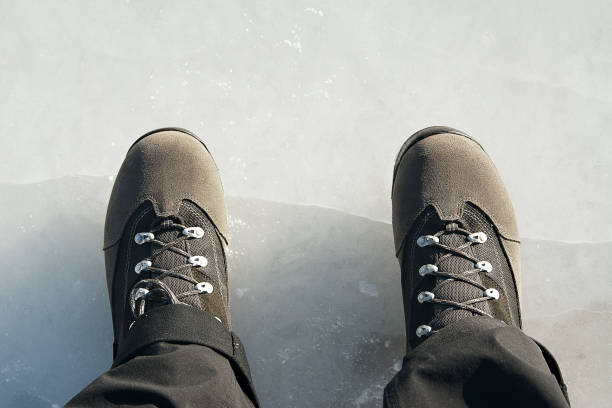 istock feet on frozen ice 1194146573