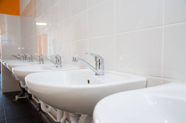 istock Close-up of row modern ceramic wash hand basins 1194147980