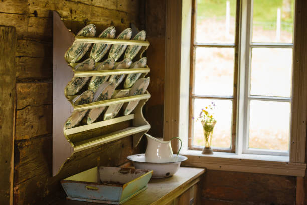 istock Vintage shelf with decorative plates in old cottage 1194152214