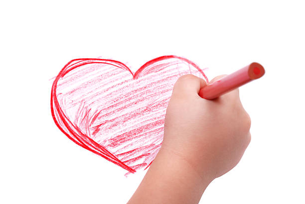 istock Childrens hand with pencil draws the heart 119415304