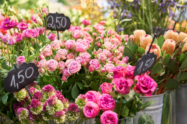 istock Vases with different colored flowers, showcase flower shop. Beautiful spring bouquets. . Small family business. Work florist. copy space 1194153285