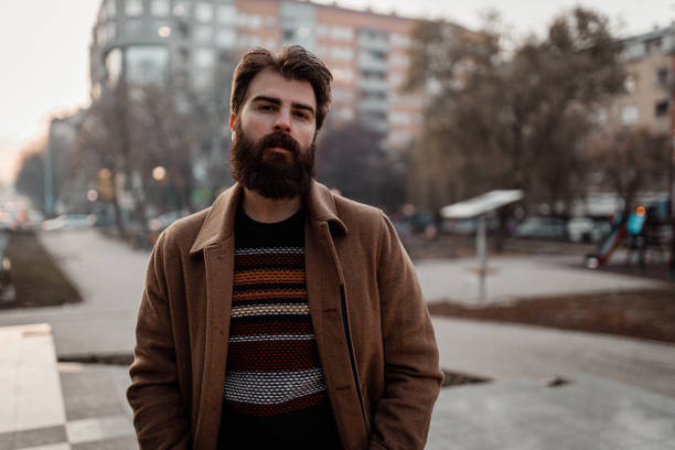 istock Handsome bearded man walking in the park on a winter day 1194153619