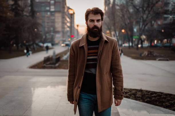 istock Handsome bearded man walking in the park on a winter day 1194153643