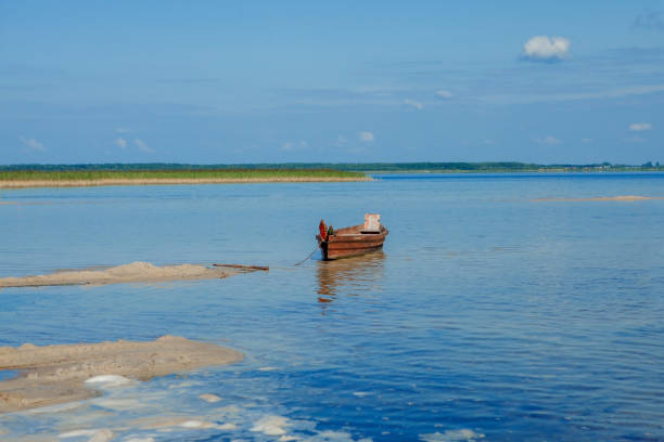 istock Boat on the lake with reflection 1194155910