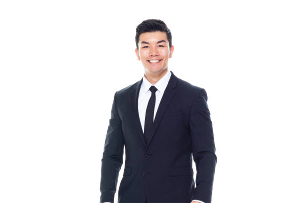 one man only / one person / front view / waist up of 20-29 years old adult handsome people chinese ethnicity / east asian ethnicity young men / male businessman / business person standing wearing necktie / a suit who is smiling / happy / cheerful - 11992 imagens e fotografias de stock