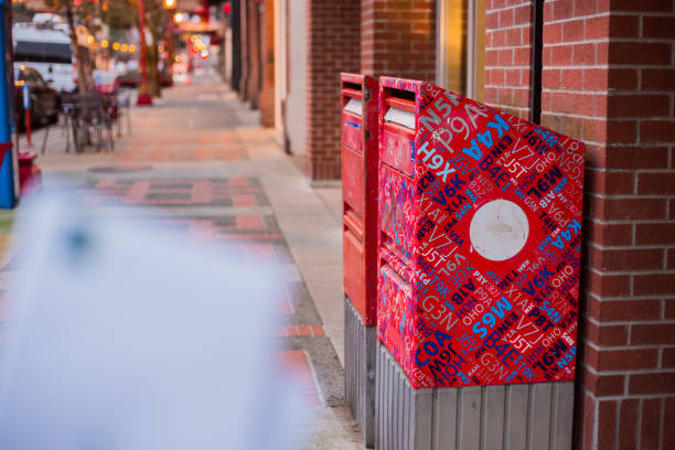 Victoria, Canada - December 3, 2019. De-focused letters on their way to Canada Post mailboxes in downtown Victoria.