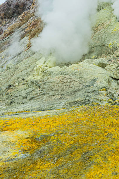 White Island volcanic features Whakaari/White Island is an active andesite stratovolcano, situated 48 km (30 mi) from the east coast of the North Island of New Zealand, in the Bay of Plenty. The nearest mainland towns are Whakatane and Tauranga. The island is roughly circular, about 2 km (1.2 mi) in diameter, and rises to a height of 321 m (1,053 ft) above sea level. However this is only the peak of a much larger submarine mountain, which rises up to 1,600 m (5,249 ft) above the nearby seafloor. Sulphur mining was attempted but was abandoned in 1914 after a lahar killed all 10 workers. The main activities on the island now are guided tours and scientific research. sulphur landscape fumarole heat stock pictures, royalty-free photos & images