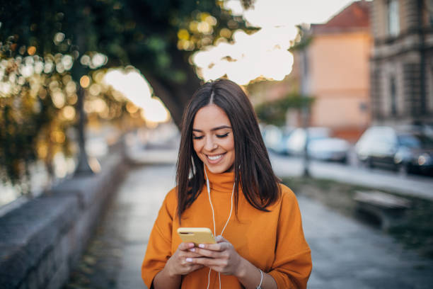 istock Beautiful woman using phone 1194166655