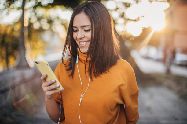 istock Beautiful woman using phone 1194166801