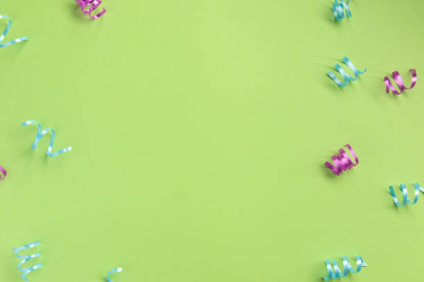istock Serpentine on green  background. Celebration concept .Flat lay, top view, copy space. 1194166826