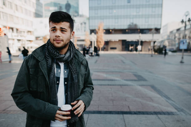 istock Handsome young man on a walk in town 1194172282
