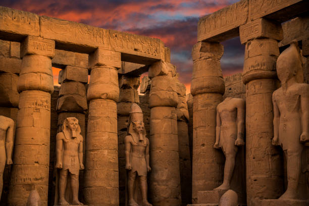 Colossal sculptures of ancient Egypt in the Nile Valley in Luxor, Egypt colossal sculptures of ancient Egypt in the Nile Valley in Luxor, Embossed hieroglyphs on the wall temple of luxor hypostyle hall stock pictures, royalty-free photos & images