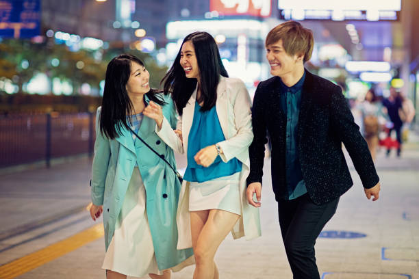 istock Happy friends are walking and making fun together 1194172439