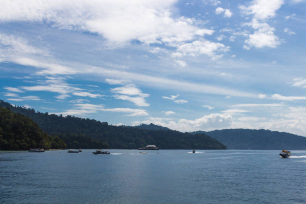 istock blue sea  with boats and blue sky with clouds 1194173160
