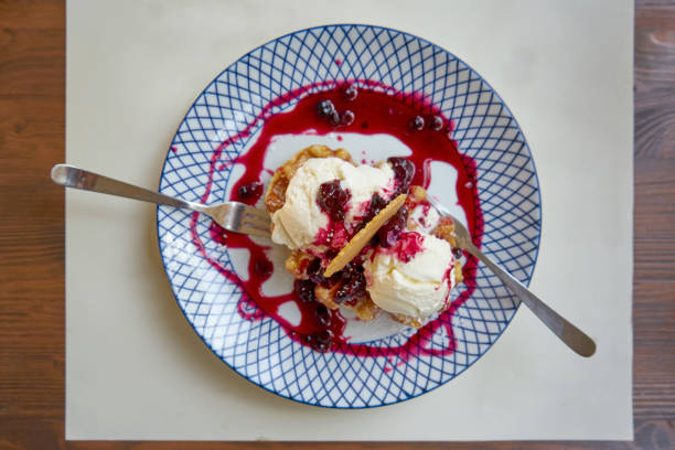 istock Vanilla Ice Cream Served On a Plate With Wild Berries Dressing And Wafers 1194173832