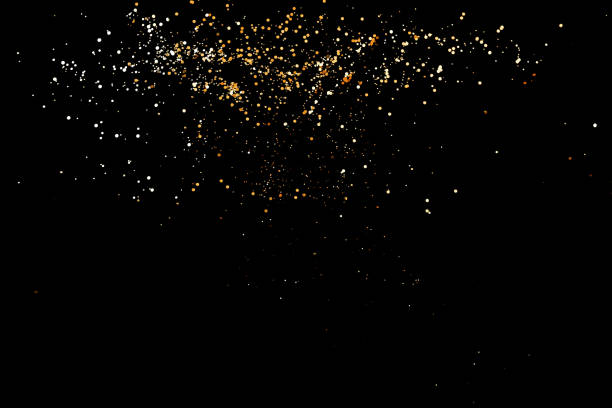 istock Golden sparkles on black background 1194177430