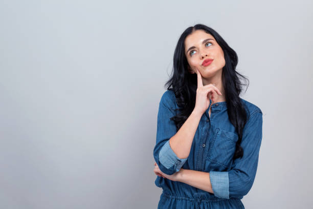 istock Young woman in a thoughtful pose 1194177539