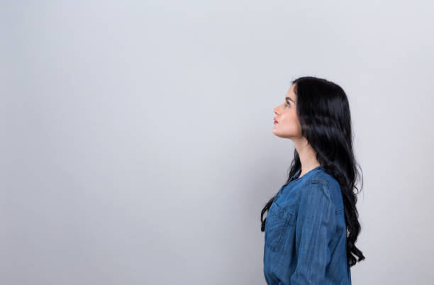 istock Young woman profile shot 1194177558