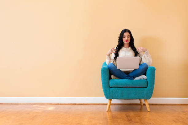 istock Young woman with a laptop computer 1194177572