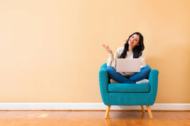 istock Young woman with a laptop computer 1194177590