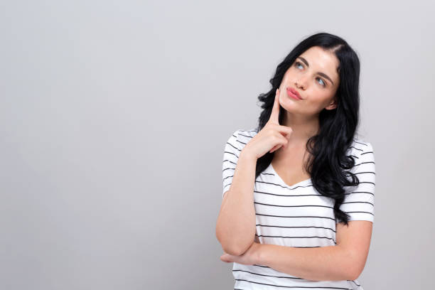 istock Young woman in a thoughtful pose 1194185046