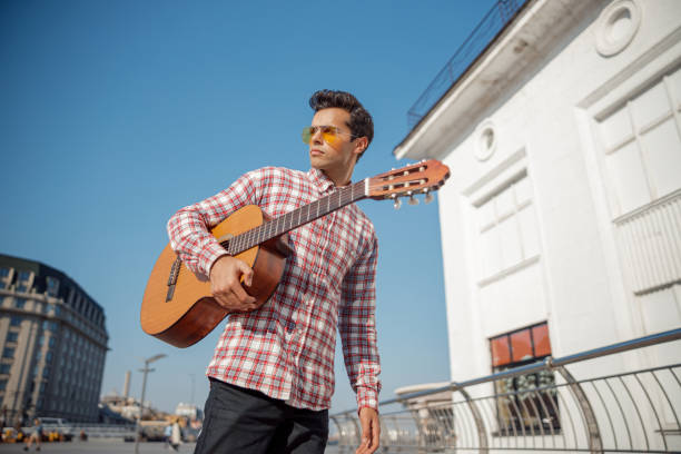 istock Young musician is walking with his instrument 1194188124