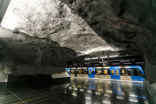 Escalators surrounded by bare rock at Rådhuset subway station, Stockholm.