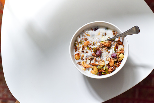 A bowl of mixed granola, nuts, seeds and dried fruit