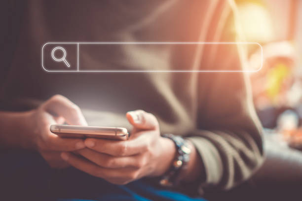 istock People hand using mobile phone or smartphone searching for information in internet online society web with search box icon and copyspace. 1194192008