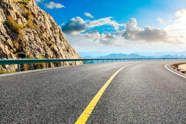 istock Empty road and mountain with beautiful clouds landscape. 1194192711
