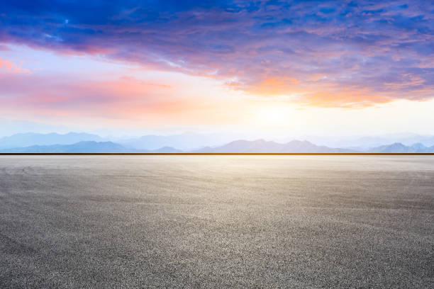 istock Race track ground and mountain with clouds at sunset. 1194192768
