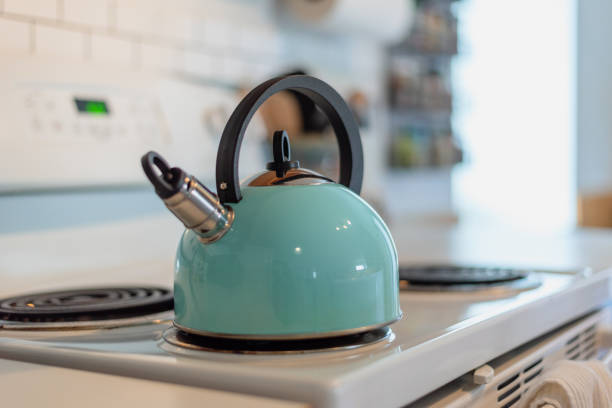 Modern Tea Kettle Sitting On Stove In Morning Light Stock Photo - Download  Image Now - iStock