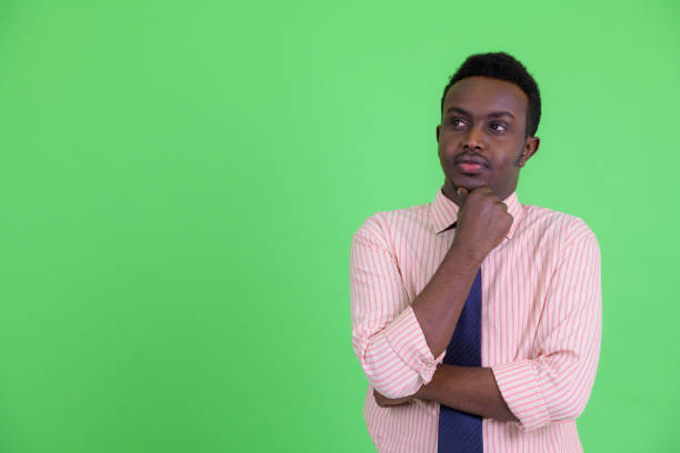 istock Young African businessman thinking and looking up 1194196133