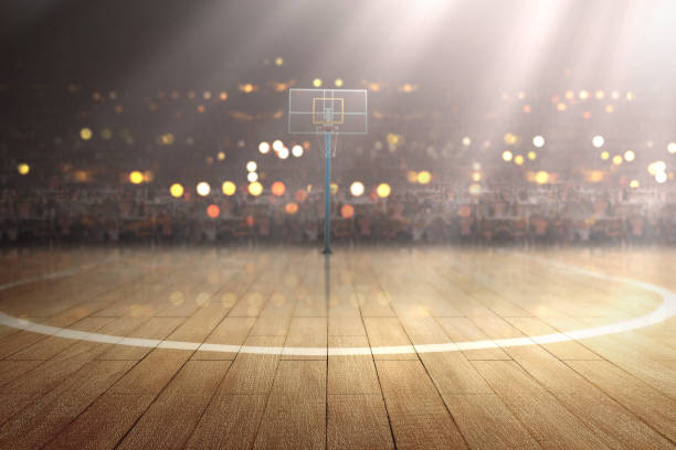 Basketball court with wooden floor and tribune Basketball court with wooden floor and tribune over blurred lights background sports court photos stock pictures, royalty-free photos & images