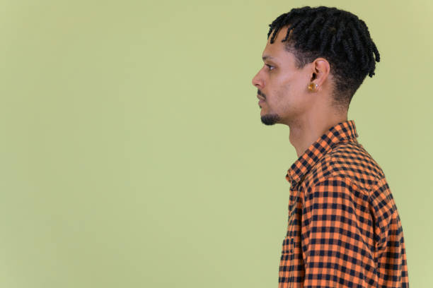 istock Profile view of young handsome African man with dreadlocks 1194197114
