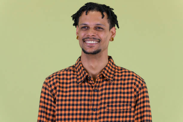 istock Face of happy young handsome African man thinking 1194197122