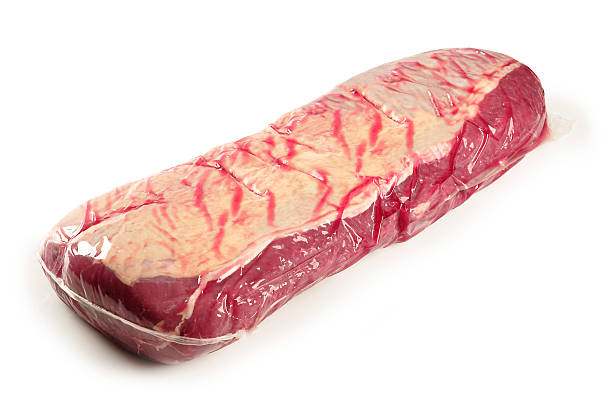 Vacuum packed raw beef tenderloin beef striploin packed in vacuum bags.Studio recording with white background vacuum packed stock pictures, royalty-free photos & images