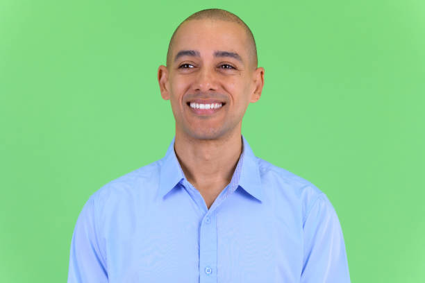 istock Face of happy bald multi ethnic businessman thinking 1194197921
