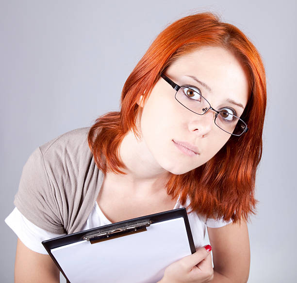 istock Young businesswomen with white plan board. 119419832