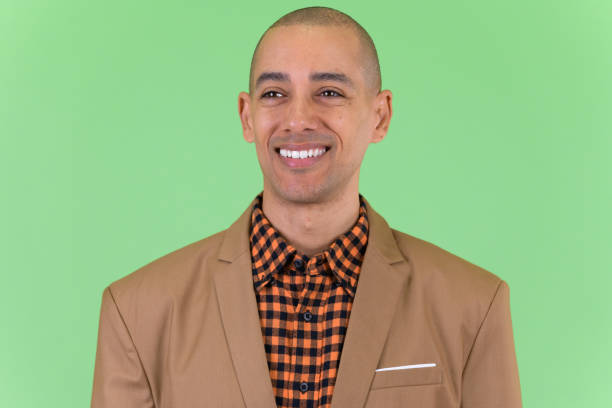 istock Face of happy bald multi ethnic businessman thinking 1194199306