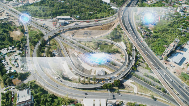 istock IoT(Internet of Things) smart highway futuristic technology and Transportation system concept. aerial view urban road. Communication network. Autonomous car technology of future. 1194201327