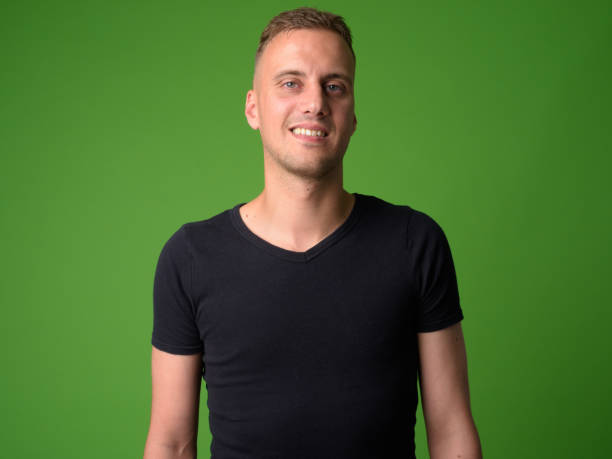 istock Face of happy handsome man smiling and looking at camera 1194201734