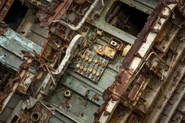 Photo of Internal parts of decommissioned marine ship that was cut and left on the shore.