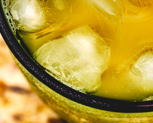 Passion fruit juice with ice cubes.